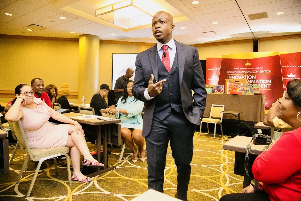Dr. Karim R. Ellis engaging directly with audience members during a live session