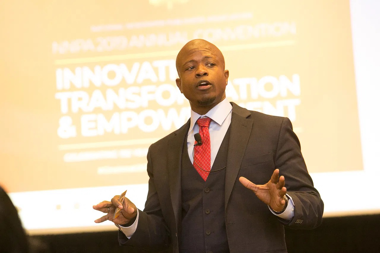 Dr. Karim R. Ellis delivering a keynote at the NNPA Annual Convention